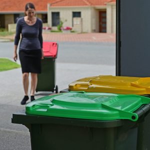 Adult,Woman,Collecting,Rubbish,Bin,From,Road,Side,On,Rubbish